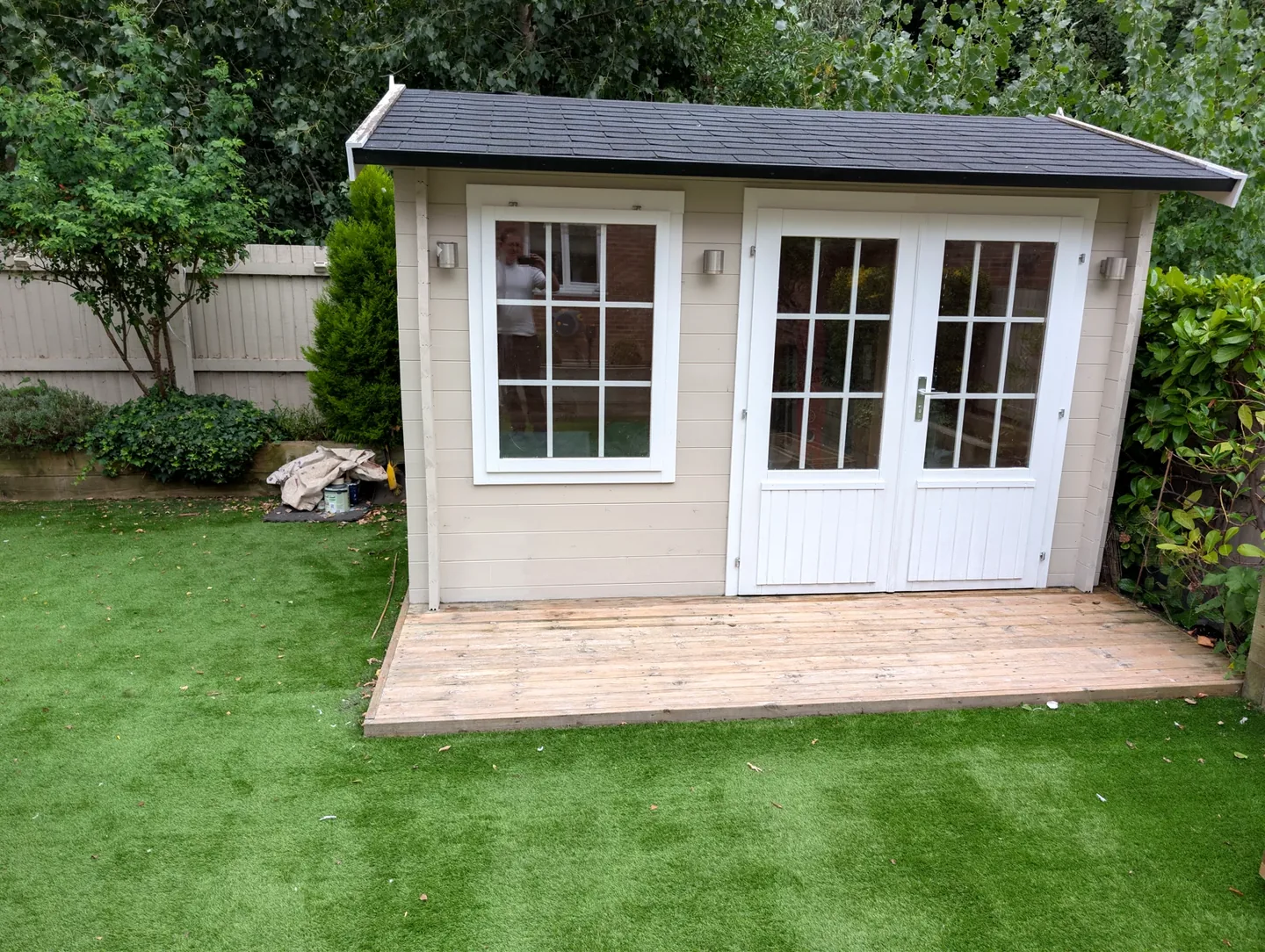 Pale painted garden room with white doors and windows