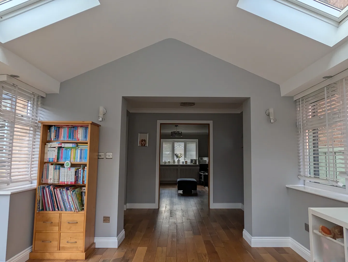 White sunroom ceiling and grey wall surrounding the doorway